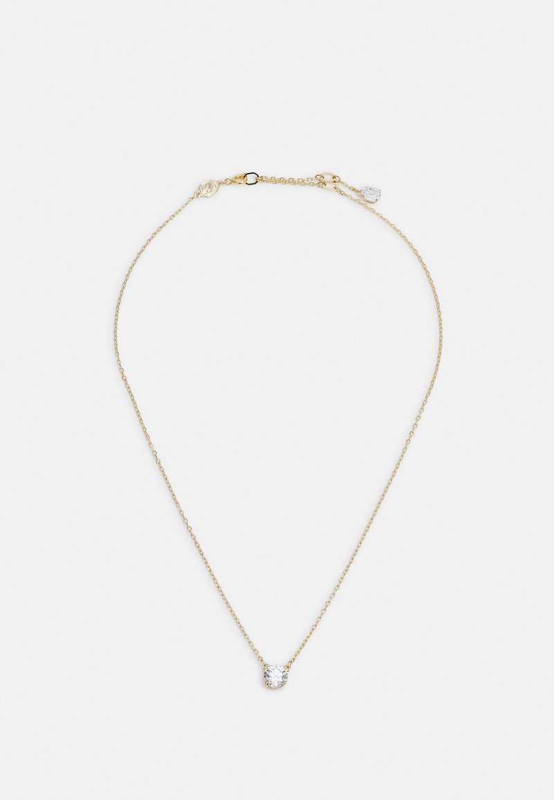 Gullkjede med et delikat design, som har en sentral klar edelsten som aksent og en hummerlås som lukking.