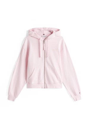 Pink zip-up hoodie with a spacious hood, front pockets, and ribbed cuffs. Made from soft fabric, featuring a subtle logo detail on the chest.