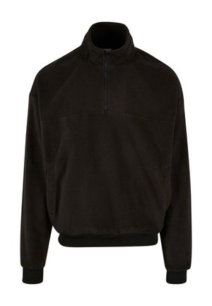 Sort fleece pullover med høj krave, halv lynlås foran og elastiske manchetter og kant. Har to sidelommer. Blød tekstur.