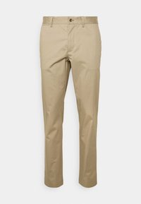 Khaki puuvillapöksyt suoranlahkeisella muotoilulla, nappikiinnitys ja sivutaskut. Sileä rakenne ja siististi viivattu muotoilu, sopii rentoon käyttöön.