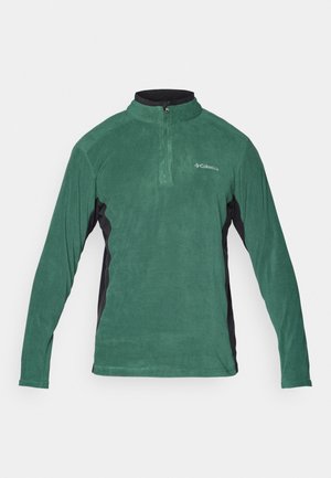 Sudadera de forro polar verde con cremallera de un cuarto, paneles laterales negros y mangas largas. Presenta una textura suave y un pequeño logotipo en el pecho.