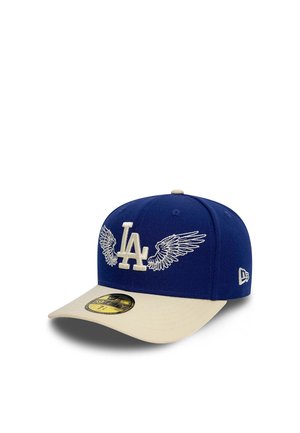 Blue and beige baseball cap with white "LA" logo and wing designs on front, shown at slight angle with gold size sticker on brim.