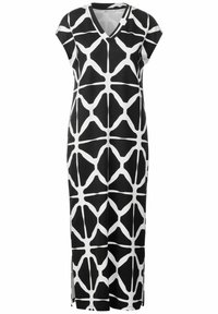 Svart och vit klänning med korta ärmar och V-ringning, prydd med ett geometriskt mönster. Tillverkad av mjukt tyg med sidoflikar för ökad rörlighet.