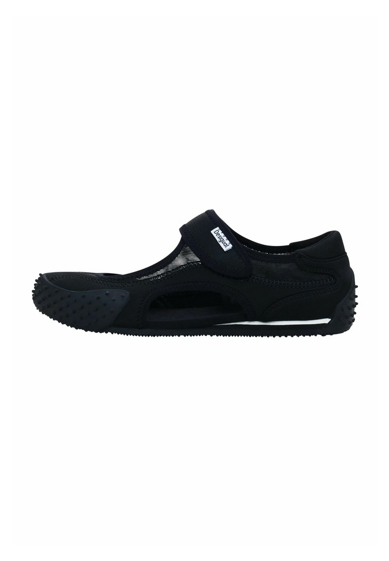 Black water shoes with a mesh design, Velcro strap, and textured rubber sole featuring grip points for enhanced traction.