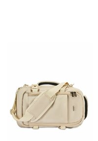 Beżowa torba sportowa z tkaniny z regulowanym paskiem na ramię, podwójnymi uchwytami na górze, kieszenią na zamek błyskawiczny z przodu oraz wyściełanymi akcentami bocznymi.