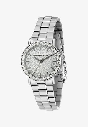 Silberne Karl Lagerfeld Armbanduhr mit zifferblatt und Lünette besetzt mit Kristallen, Metallgliederarmband und Sicherheitskette am Kronenansatz.