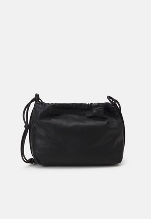 Soft black leather shoulder bag with a gathered top edge and adjustable knotted strap against a gray background.