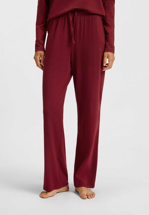Burgundy loungebyxor i mjukt, lättviktsmaterial. Har ett elastiskt midjeband med snörning och breda, raka ben.