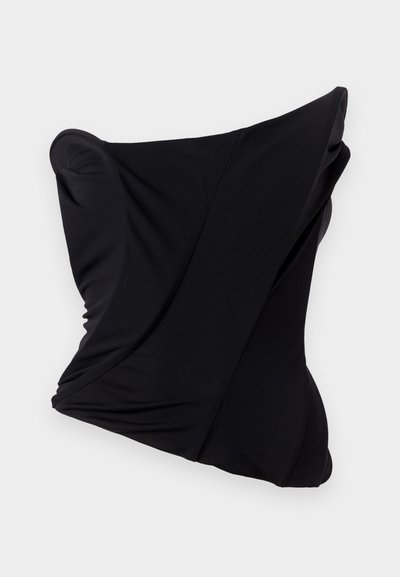 Black fabric pillow with a twisted design, featuring smooth texture and rounded edges, creating a sculptural shape.