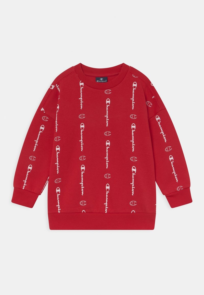 Punainen huppari, joka on valmistettu puuvillasekoitteesta, ja jossa on toistuvia valkoisia "Champion"-logoja pystysuorassa asennossa. Pyöreä kaula-aukko ja pitkät hihat, joissa on resorit.