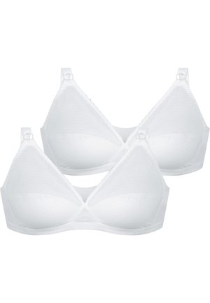 Due reggiseni wireless bianchi con coppe leggermente imbottite, spalline regolabili e una sottile texture a pois, mostrati su uno sfondo bianco.