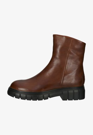 Brown leather ankle boot with a smooth texture, rounded toe, and chunky black rubber sole featuring pronounced ridges.
