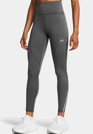 Gray high-waisted leggings with a smooth texture, featuring a tapered fit, side seams, and white accents along the lower legs.