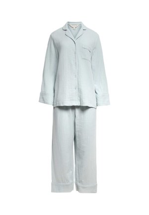 Lichtblauw gestructureerd katoenen pyjamaset met een overhemd met lange mouwen en knopen, een borstzak en wijde broekspijpen met boorden.