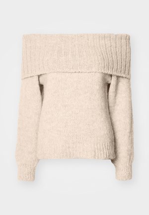 Bež pulover brez naramnic, izdelan iz teksturirane pletenine, z širokim rebrastim izrezom in dolgimi rokavi s tesnimi manšetami.