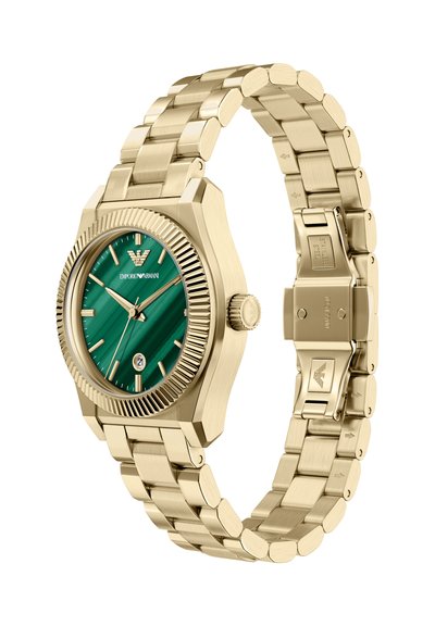 Gold stainless steel watch with a green dial, ridged bezel, and date function. The bracelet features interlocking links with a deployant clasp.