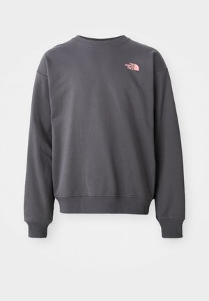 Szürke pamut keverék pulóver, kerek nyakkal, bordás mandzsettával és szegéllyel. Egy kis rózsaszín logó található a bal felső mellrészen.