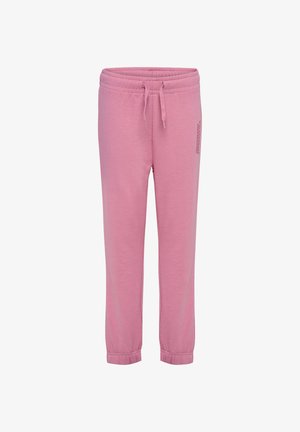 Boy standing wearing pink hummel sportswear hoodie and matching sweatpants with navy blue sneakers against a white background.