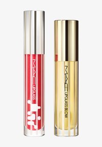 To lipgloss i transparente rør. Til venstre: klar rød med hvite striper og logo. Til høyre: gul gloss i et gullstripet rør.