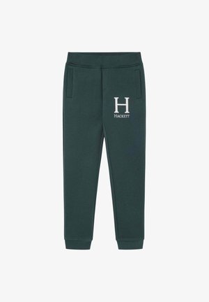 Dunkelgrüne Sweatpants aus weichem Material mit zwei Seitentaschen und einem weißen Logo "H" sowie "HACKETT" auf dem linken Oberschenkel.