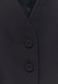 Mango JORDAN - Strukirani kaput - black