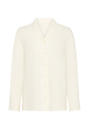 Blouse crème à manches longues avec boutons à l'avant, col cranté et bordure en dentelle festonnée sur les poignets et les épaules.
