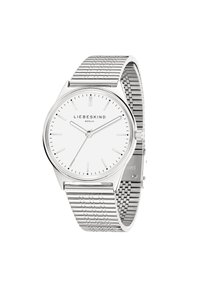 Runde Silberuhr mit einem weißen Zifferblatt, silbernen Stundenmarkierungen und einem Mesh-Armband. Einfaches Design mit minimalen Akzenten.