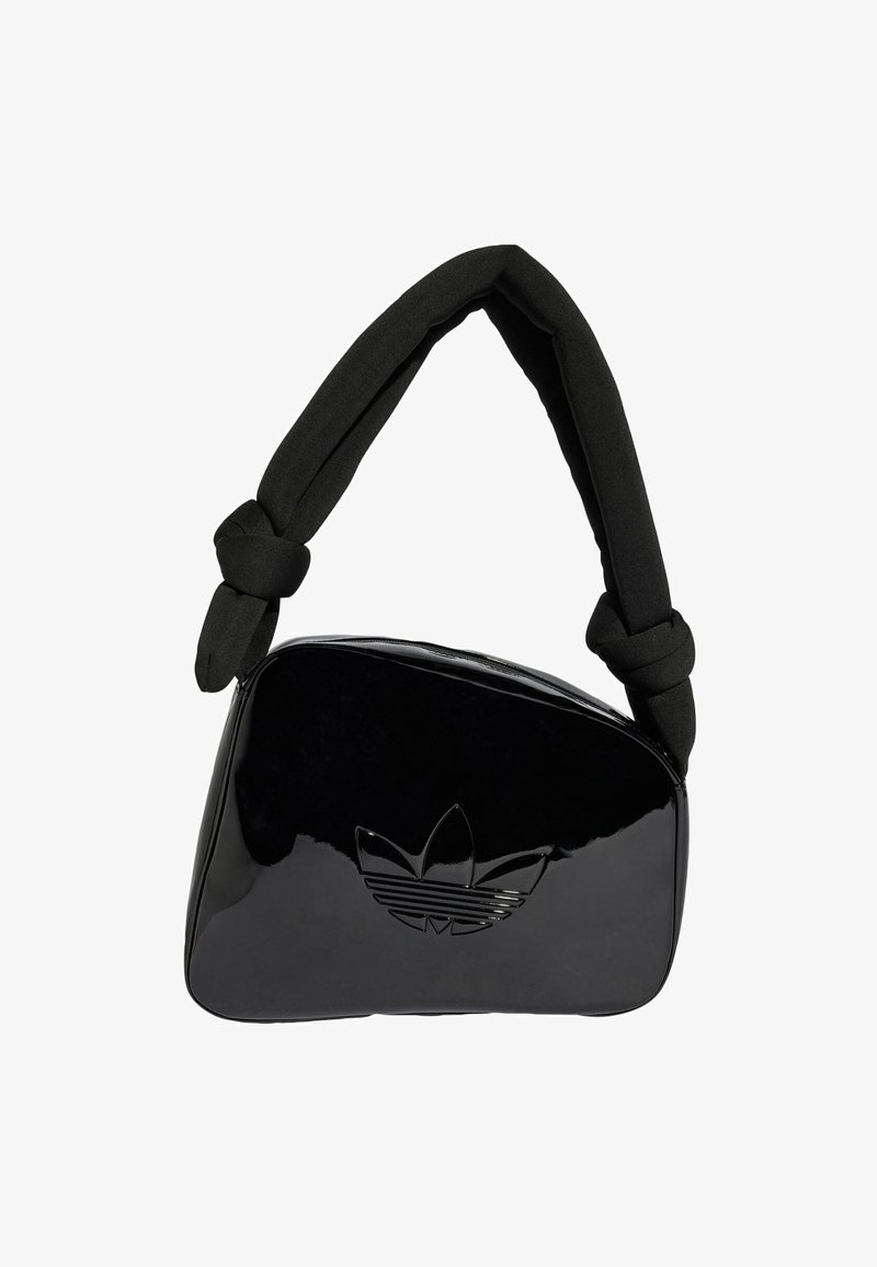 Black patent leather bag with a knotted black fabric handle. Features a raised Adidas trefoil logo on the front. Smooth, shiny finish.
