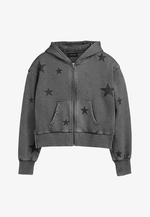 Sweat à capuche zippé gris avec poches avant, poignets côtelés et motifs d'étoiles noires dispersés sur les manches et l'avant.