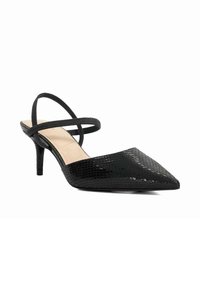 Black slingback heel with a pointed toe. Textured snake print design, slender straps, and a 6 cm stiletto heel. Smooth inner lining.
