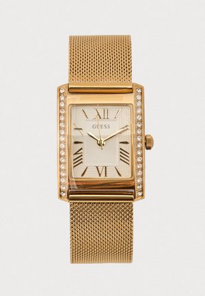 Goldene Metallgeflecht-Uhr mit rechteckigem Gehäuse, weißem Zifferblatt, römischen Zahlen und Strasssteinen auf der Lünette.