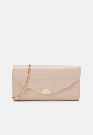 Beige clutch purse with scalloped flap, gold-tone half-circle clasp, and gold chain shoulder strap on white background.