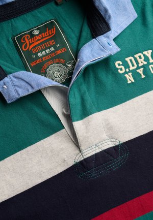 Collared rugby shirt with green, white, navy, and red stripes, blue collar, and embroidered "S.DRY NYC" text on the chest.