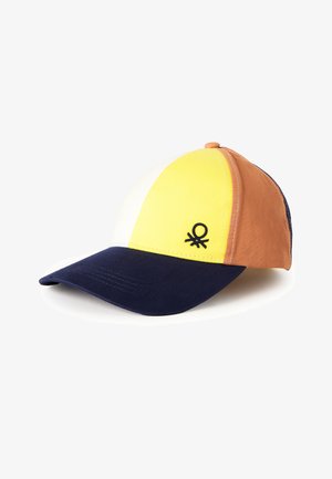 Casquette de baseball avec une visière bleu marine, des panneaux blancs, jaunes et marron, et un petit logo noir sur la section jaune.