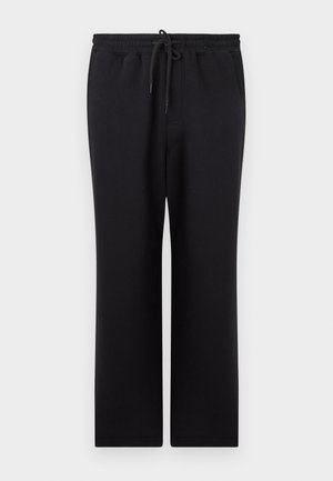 Pantalons de survêtement noirs avec taille élastique et cordon de serrage, coupe droite et poches latérales, présentés sur un fond uni.