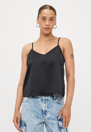 Black satin camisole with thin straps, V-neck design, and a smooth texture. Paired with light blue distressed cargo jeans.