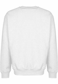 Witte sweatshirt van zacht materiaal, met een ronde hals, lange mouwen, geribbelde manchetten en een effen, gestructureerd oppervlak zonder graphics.