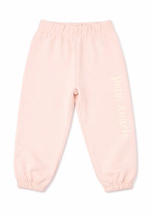 Pantaloni della tuta rosa chiaro con vita elastica, polsini elastici e testo verticale tenue sulla gamba destra, distesi su uno sfondo bianco.
