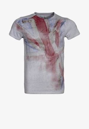 Harmaa puuvillainen t-paita, jossa haalistunut Union Jackin painatus punaisena ja sinisenä. Lyhyet hihat ja pyöreä kaula-aukko.