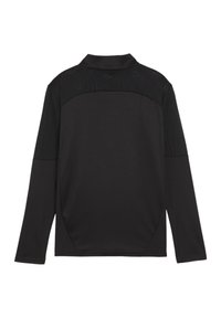 Maglietta nera a maniche lunghe con una yoke tessurata e decorata. Realizzata in un tessuto morbido e elasticizzato. Presenta un colletto classico e una vestibilità rilassata.
