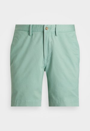 Shorts décontractés pour hommes, verts clairs, avec passants de ceinture, fermeture boutonnée et poches latérales sur fond blanc.
