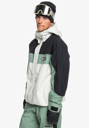 Sneeuwjack met een ontwerp in drie kleuren: zwart, wit en mintgroen. Gemaakt van waterbestendige stof met een hoge kraag en verstelbare manchetten.