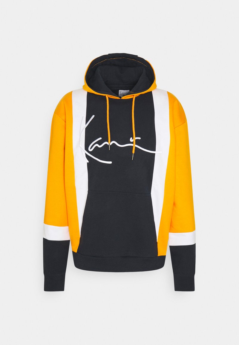 Hoodie med svart kropp och gula samt vita accenter, dragsko och framficka; slät tyg med en djärv signaturlogotyp.