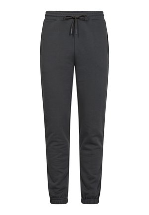Mørkegrå joggerbukser lavet af blødt stof, med elastisk talje og snoretræk, sidelommer og tapered manchetter.