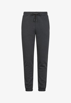Mørkegrå joggerbukser lavet af blødt stof, med elastisk talje og snoretræk, sidelommer og tapered manchetter.
