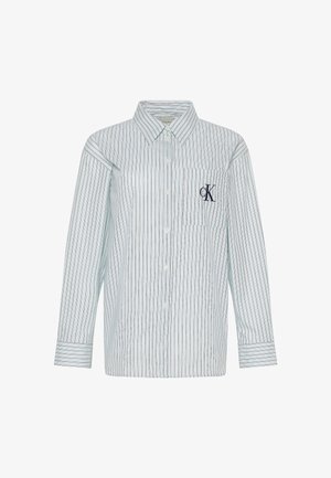 Gestreept katoenen overhemd met lange mouwen, knoopsluiting aan de voorkant, lichtblauwe basis en donkerblauwe strepen. Voorzien van een zak met logodetail.