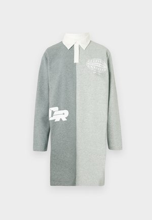 Pitkähihainen poolomekko kahdessa harmaan sävyssä, valkoisella kauluksella ja graafisilla kuoseilla. Pehmeä puuvillasekoite ja rento istuvuus.