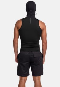 Black sleeveless top and black shorts, made of stretchable fabric. Features a hood and a back pocket with a flap. Smooth texture.