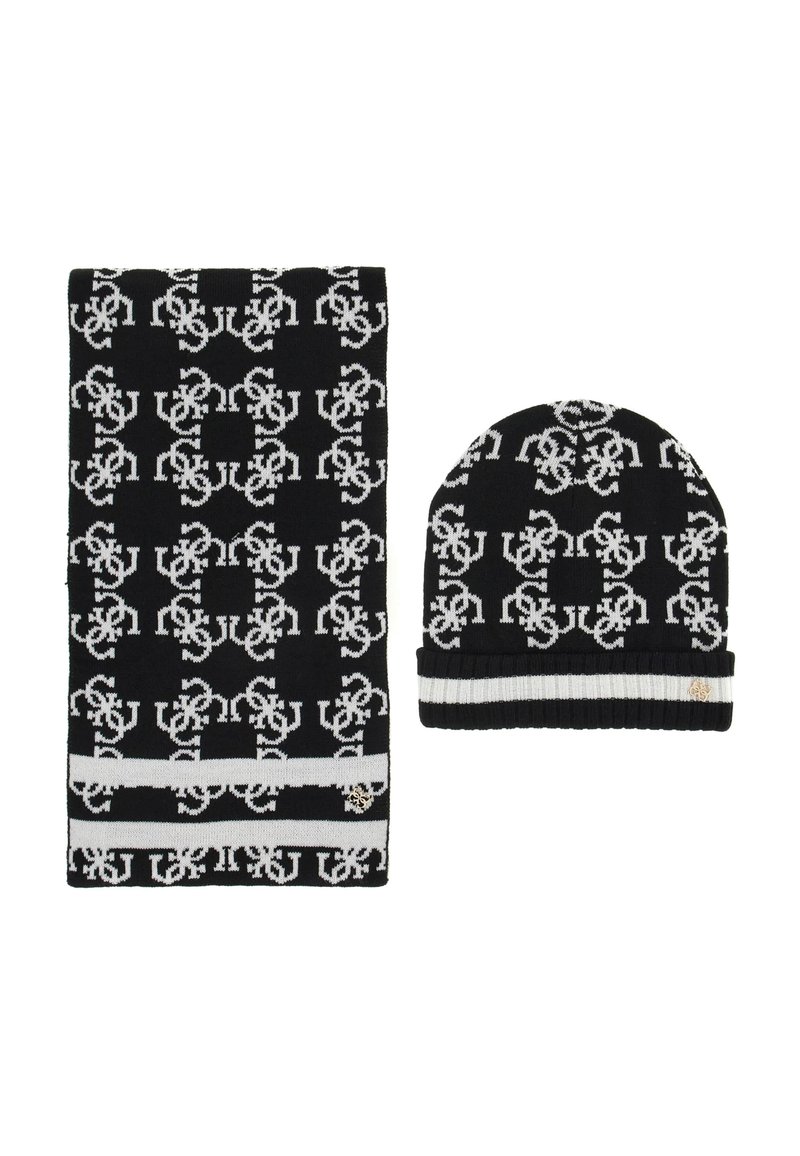 Set di sciarpa e berretto a maglia in bianco e nero con un motivo ripetitivo, caratterizzato da una spessa striscia bianca sulla sciarpa e una cuffia piegata sul berretto.