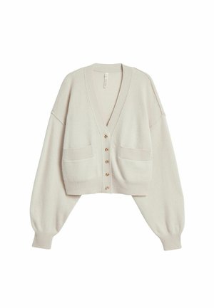 Lichtbeige cropped vest met lange pofmouwen, geribbelde manchetten, twee zakken aan de voorkant en vijf knopen in het midden.